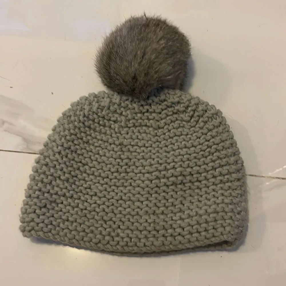 Knitted beanie with a pom pom #11